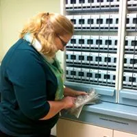 Ann working at the Parata dispensing machine