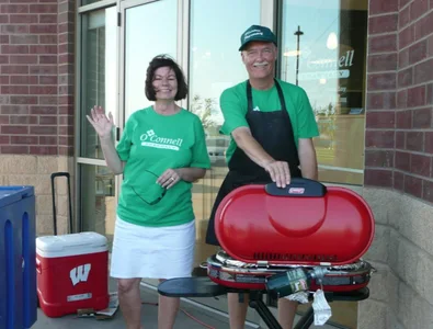Team members grilling outside the pharmacy at a customer cookout