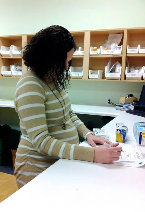 Holly performing final verification of prescriptions