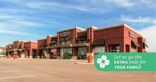The O'Connell Pharmacy storefront with a banner reading 'Let us go the extra mile for your family'