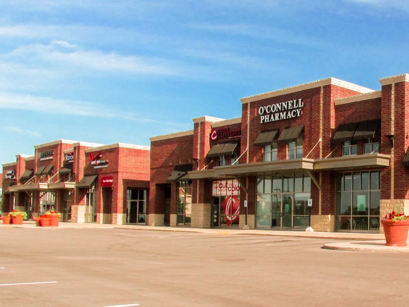 The O'Connell Pharmacy storefront on Grand Avenue in Sun Prairie on a sunny day